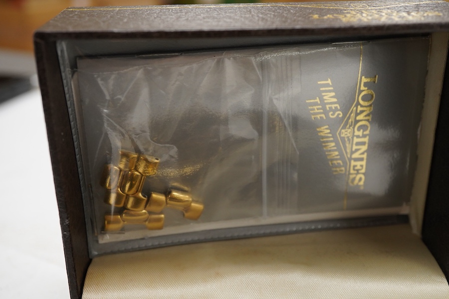 A gentleman's early 1990's stainless steel and gold plated Longines quartz wrist watch, with spare links and box, case diameter 34mm.